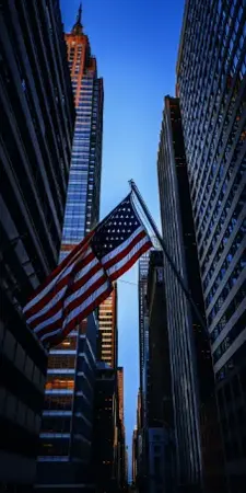 US flag over New York City, home to leading bookkeeping firms