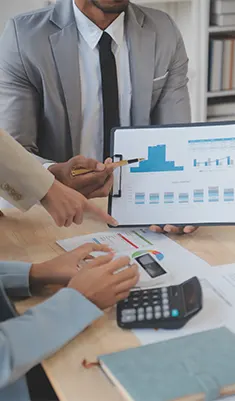 Experts managing Bookkeeping Franchises by presenting quarterly growth reports and ensuring tax compliance for franchise owners.