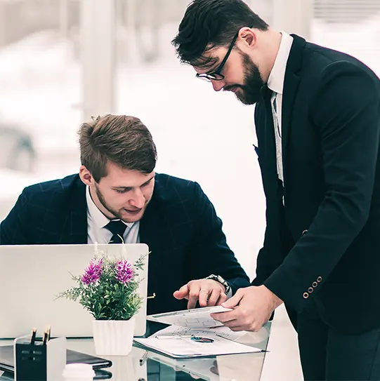 Outsourced CFO for franchises reviewing financial performance dashboards and franchise revenue metrics.