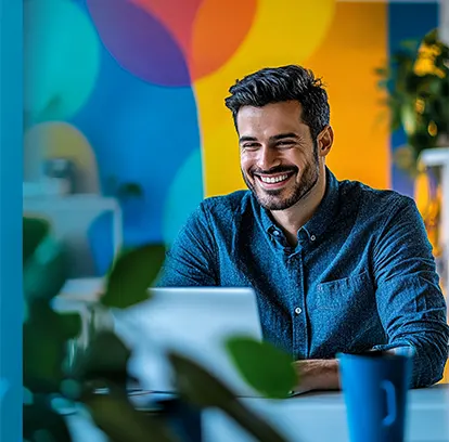 Startup founder reviewing payroll reports on a laptop using online payroll services for startups.