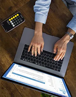 A specialist performing digital invoice processing on a laptop to streamline startups payable services and improve operational efficiency.