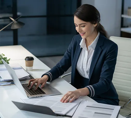 Professional using outsourced payroll services in New York to process payroll on a laptop