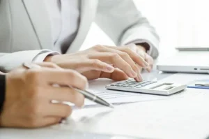 Business professional using a calculator for financial planning